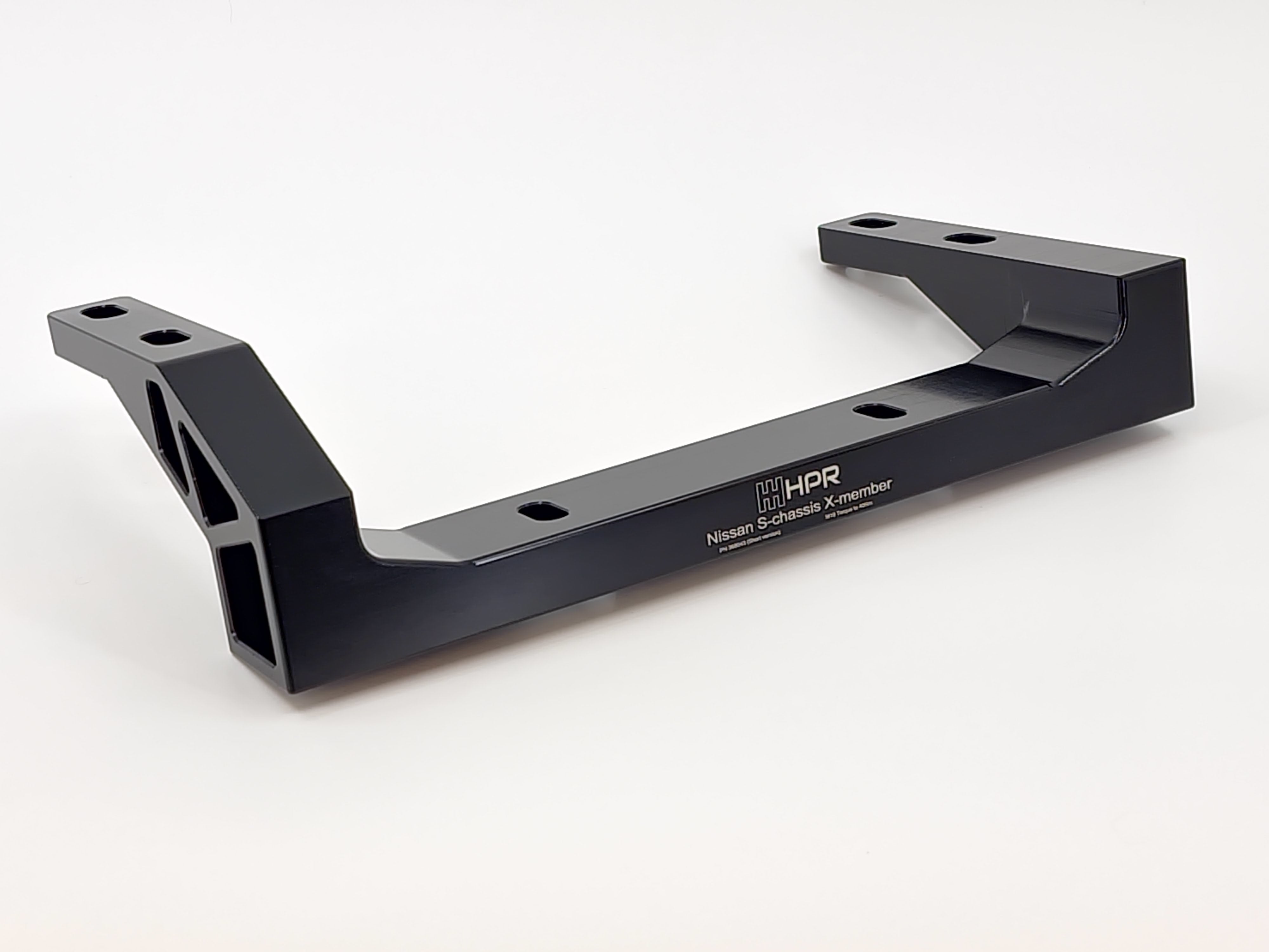 Black metal chassis X-member with U-shaped ends and bolt holes