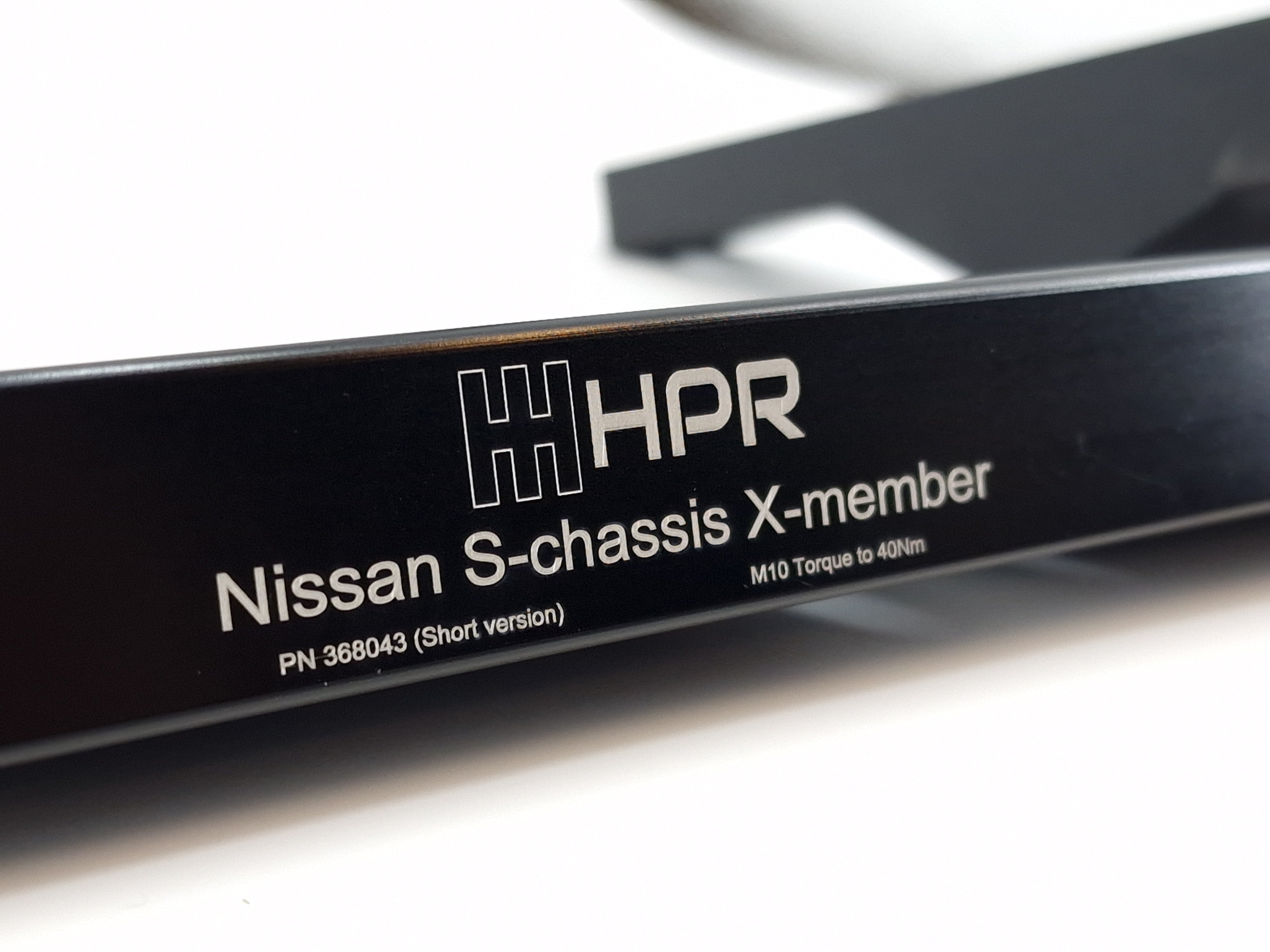 Black chassis X-member with HPR logo and Nissan S-chassis X-member label