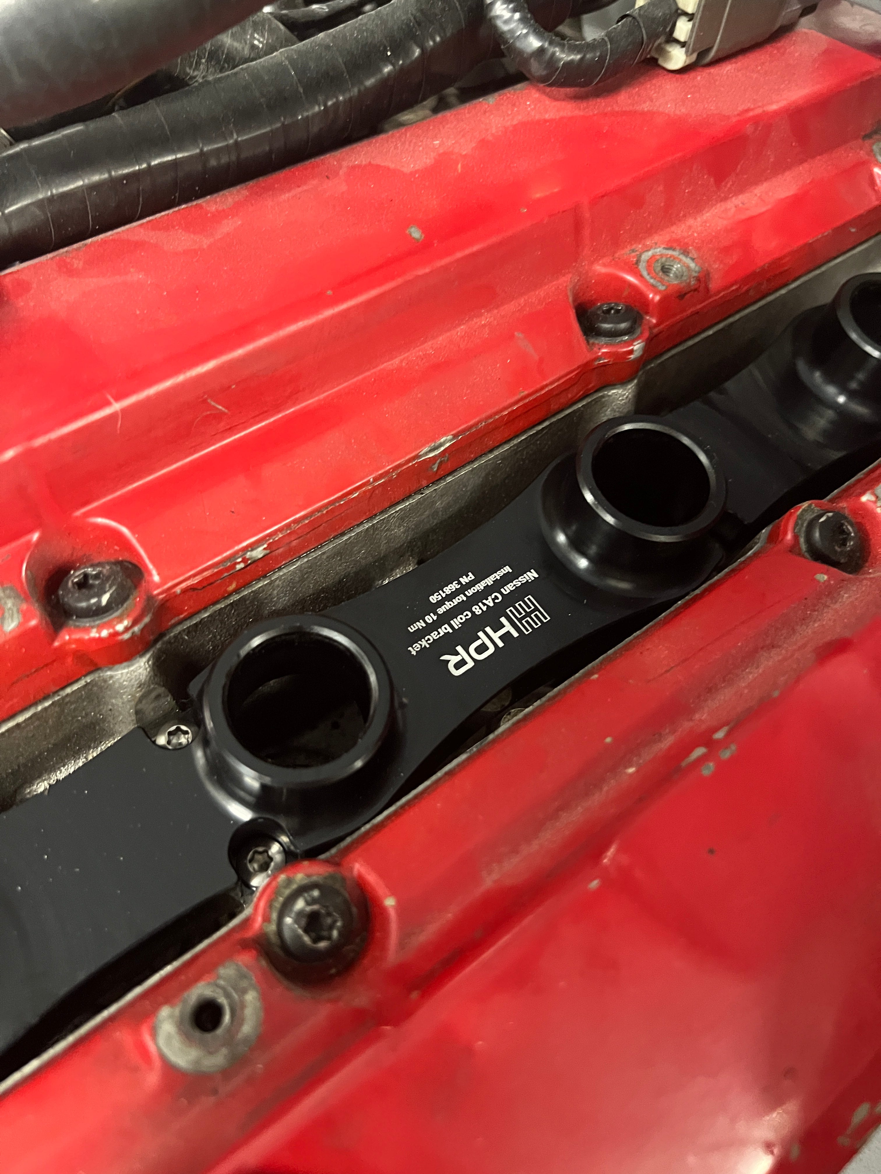 HPR Nissan CA18 coil bracket mounted onto a CA18 engine.