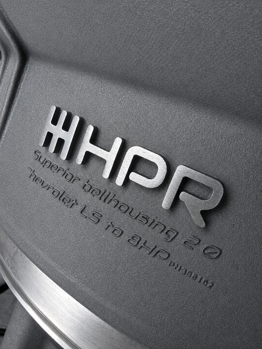 Stamped Super bellhousing text on dark gray bellhousing housing