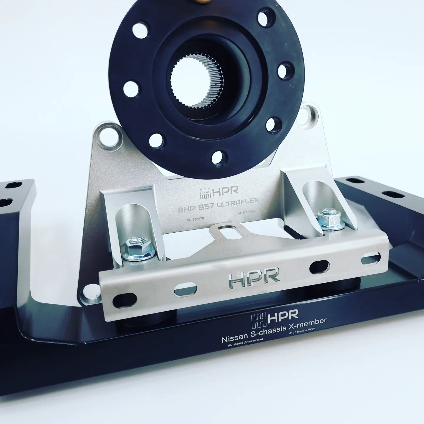 Vehicle chassis mount kit with blue wheel hub flange and silver metal bracket