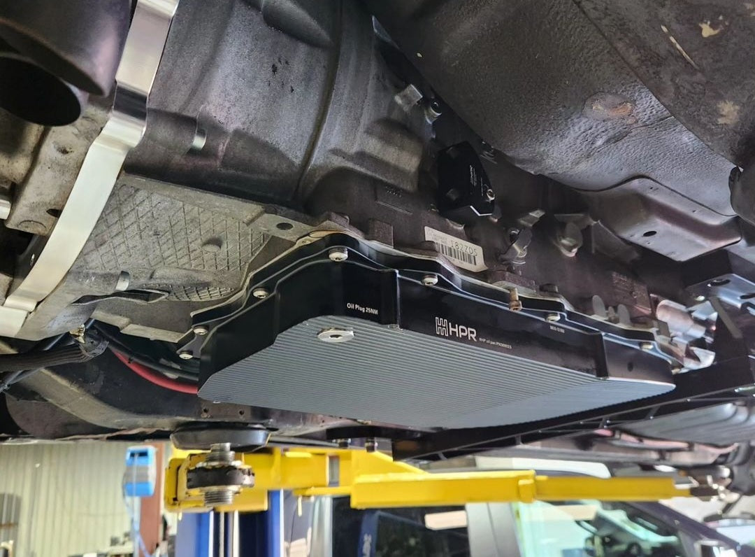 Transmission package transmission case with sensor and mounting brackets, underside view