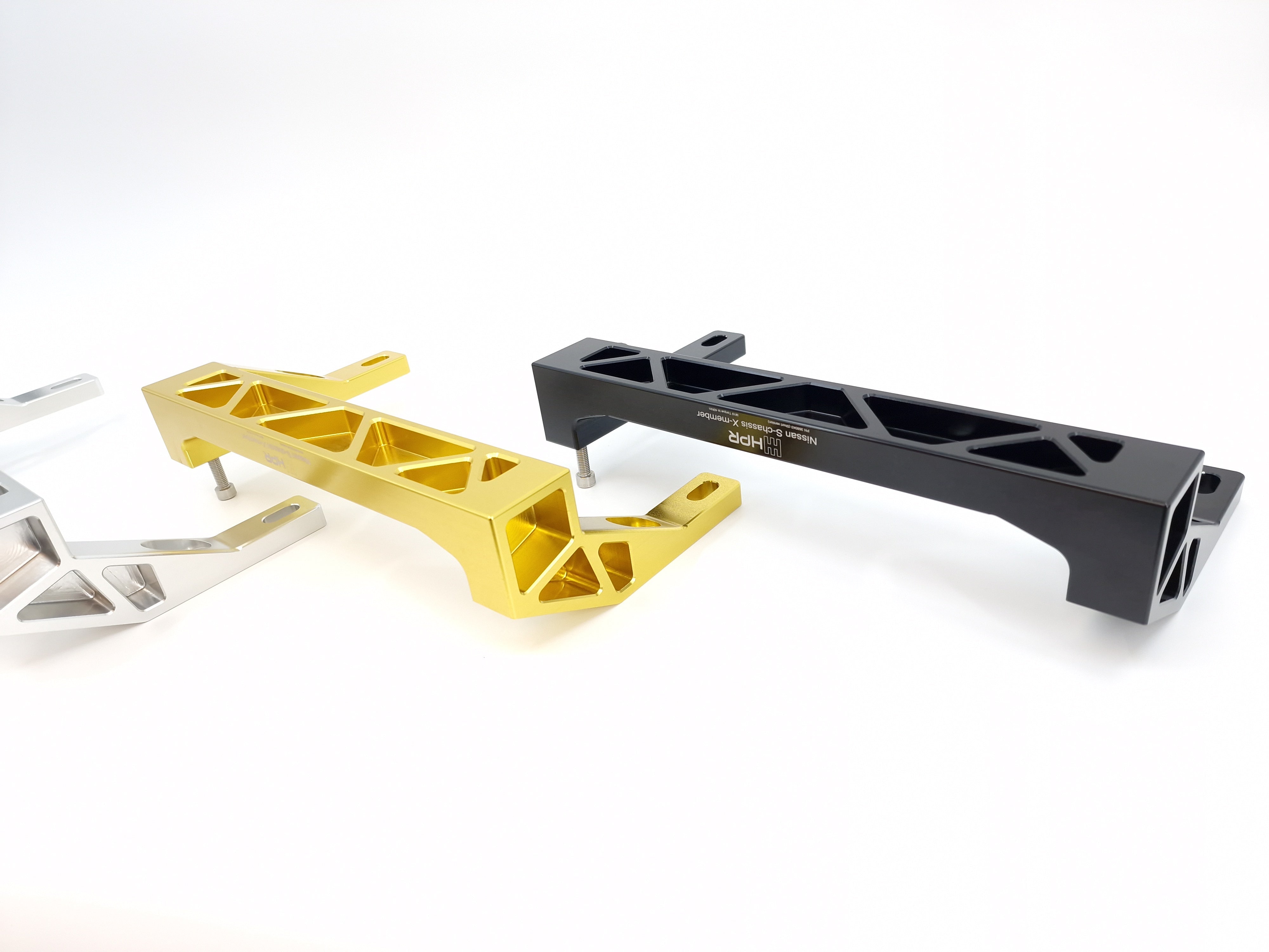 Assorted bracket pieces in black, silver, and gold finishes with cutouts