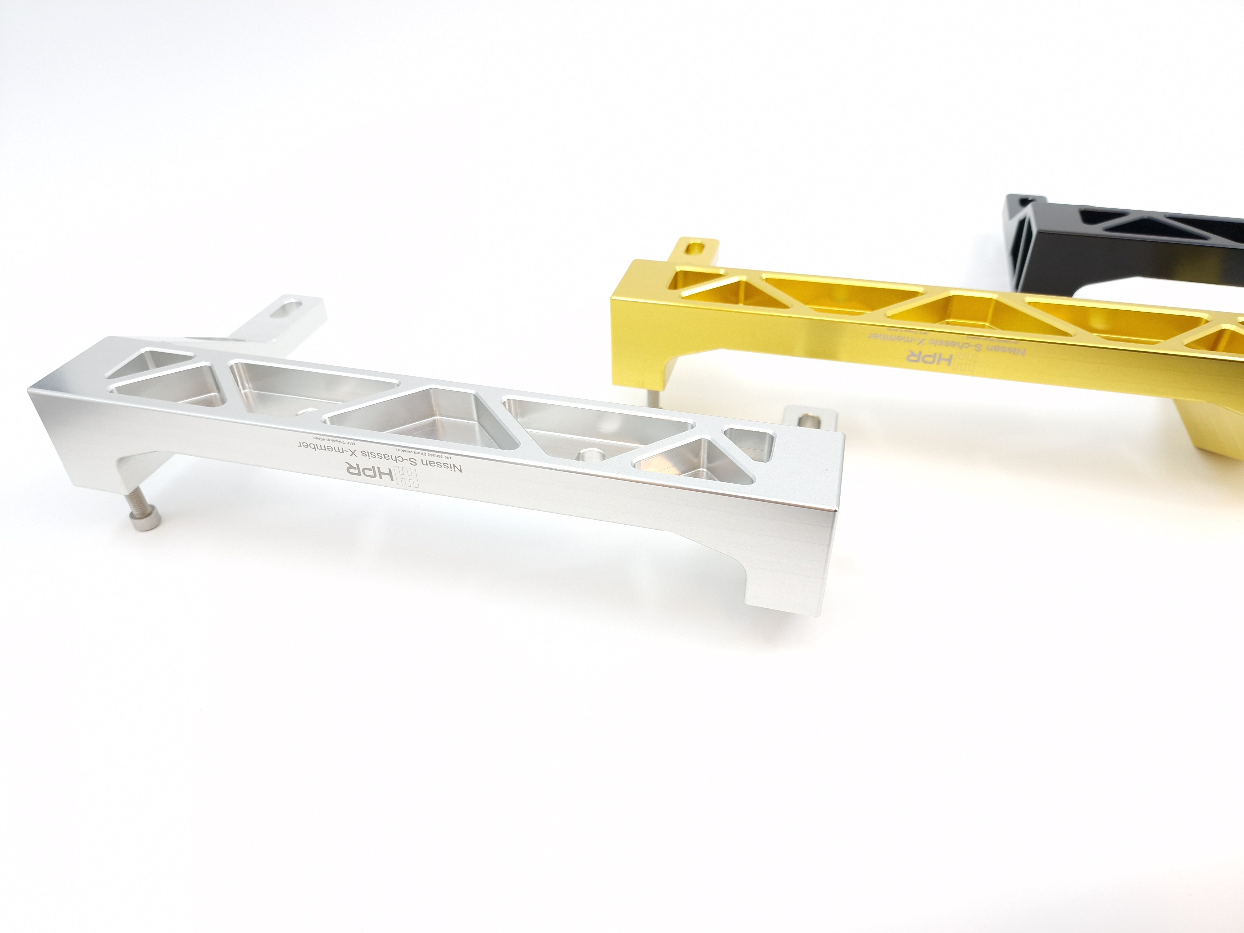 Metal chassis crossmember set in white with multiple rectangular cutouts