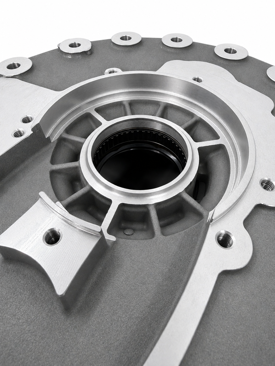 Superior bellhousing kit close-up of central opening with machined silver fins and bolts
