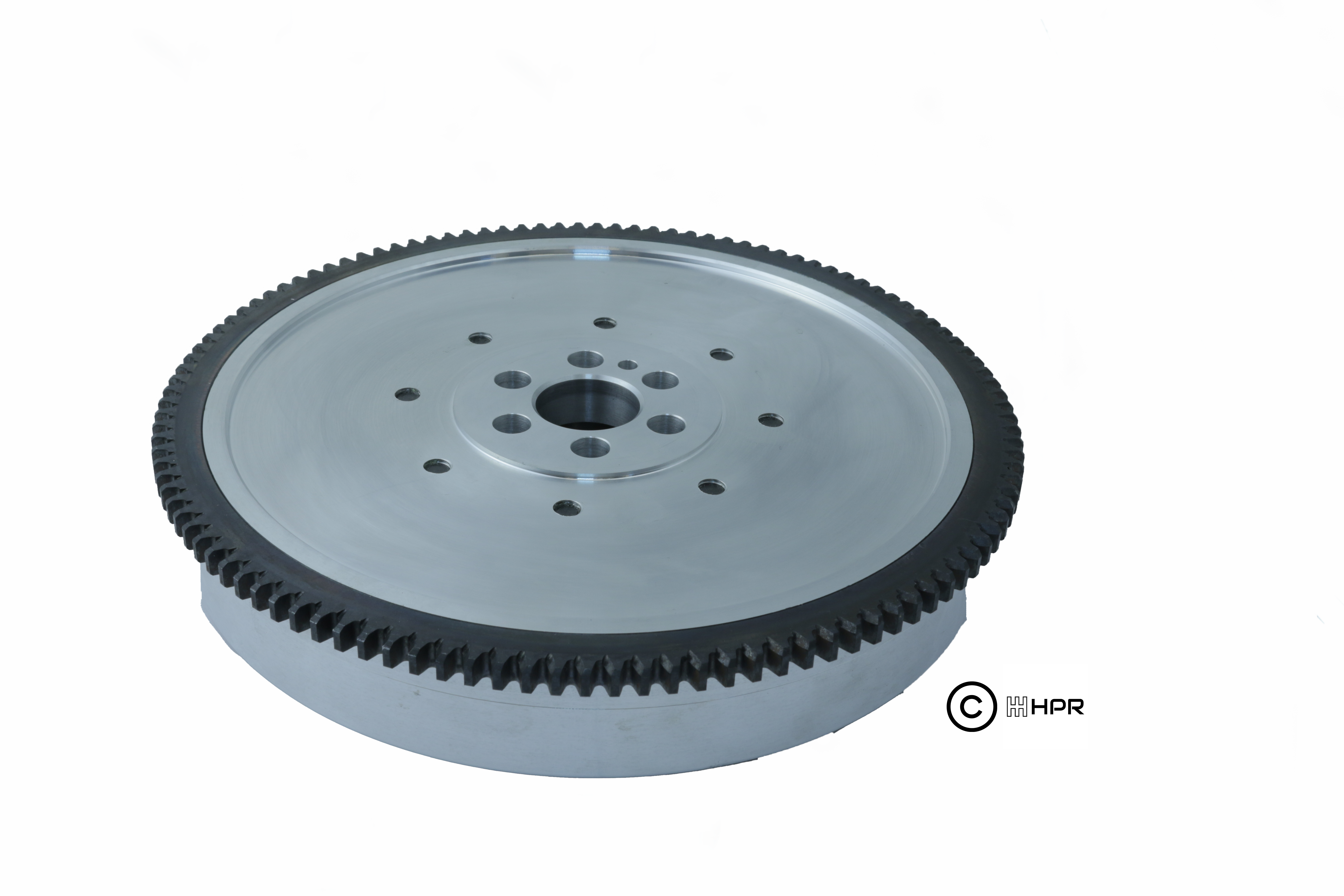 Silver flywheel-style gear ring with bolt holes and central hub opening