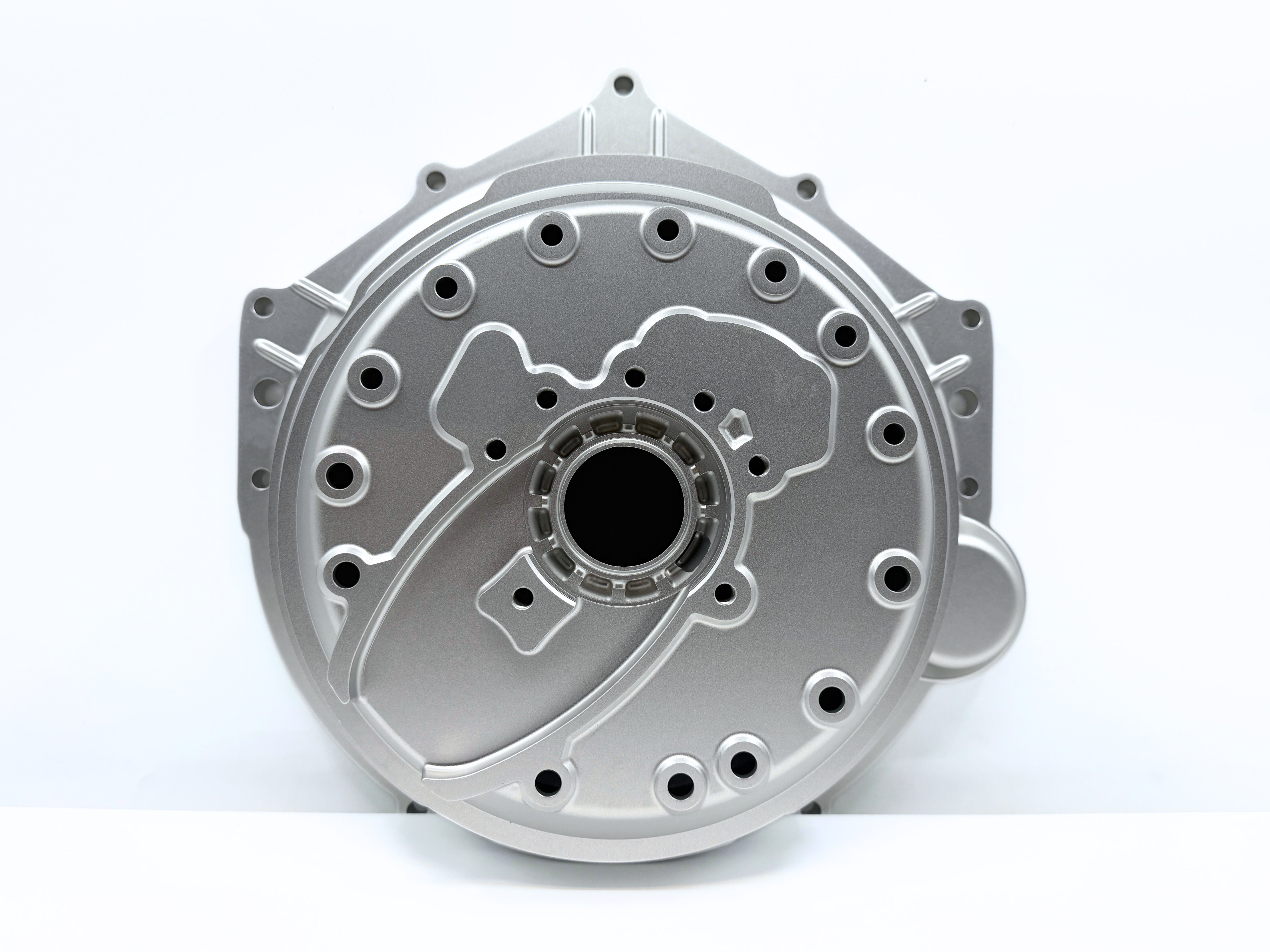 Stamped metal bellhousing with circular port and mounting bolt holes