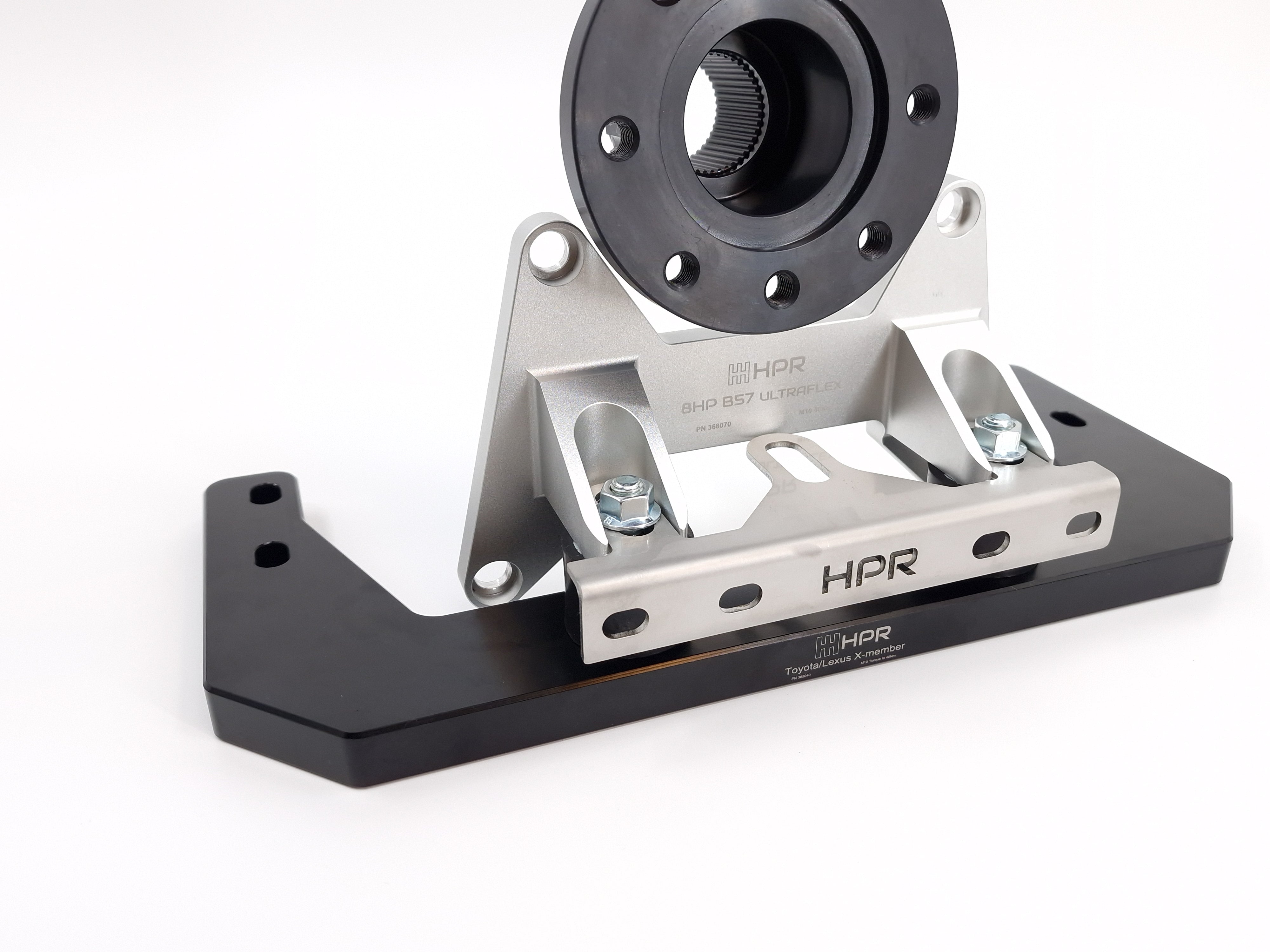 An 8HP HPR transmission kit component, featuring a billet aluminium transmission crossmember and a rear mount kit.