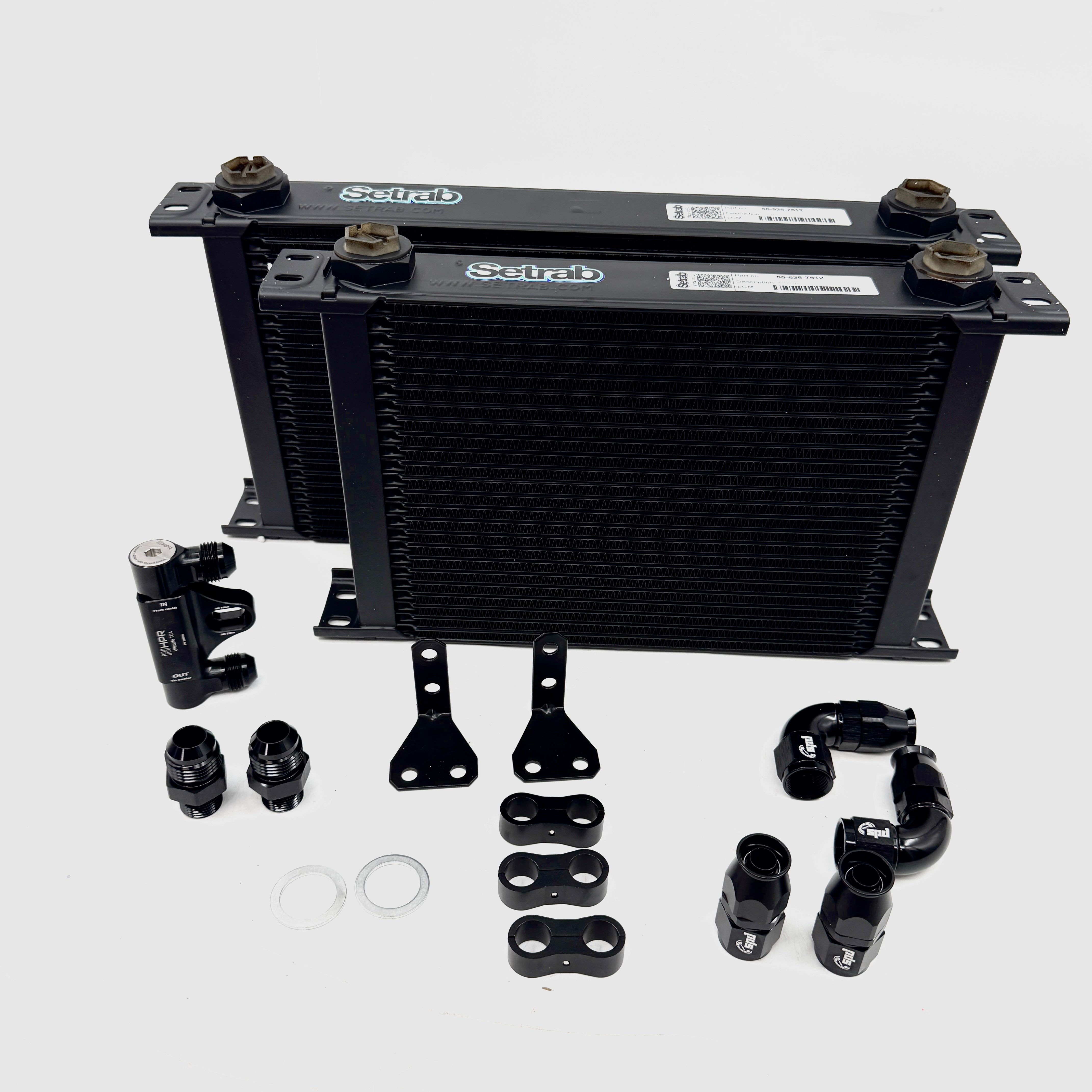 Oil cooler kit with black heat exchanger, mounting brackets, hoses and fittings
