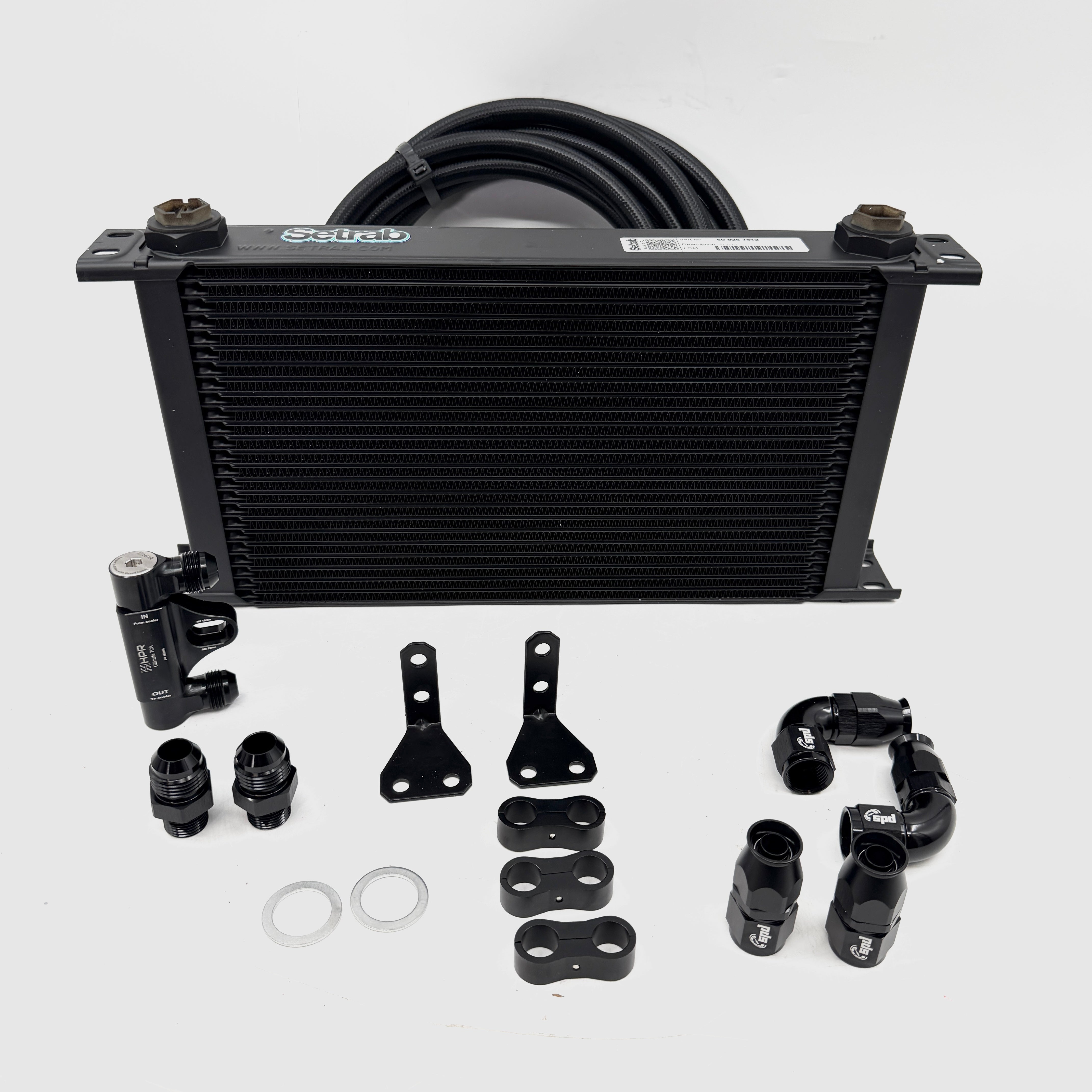 Oil cooler kit with black oil cooler core, brackets, seals, and curved fittings