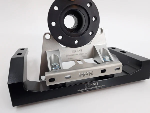 Vehicle kit chassis with steering hub mounting plate, black and silver metal brackets