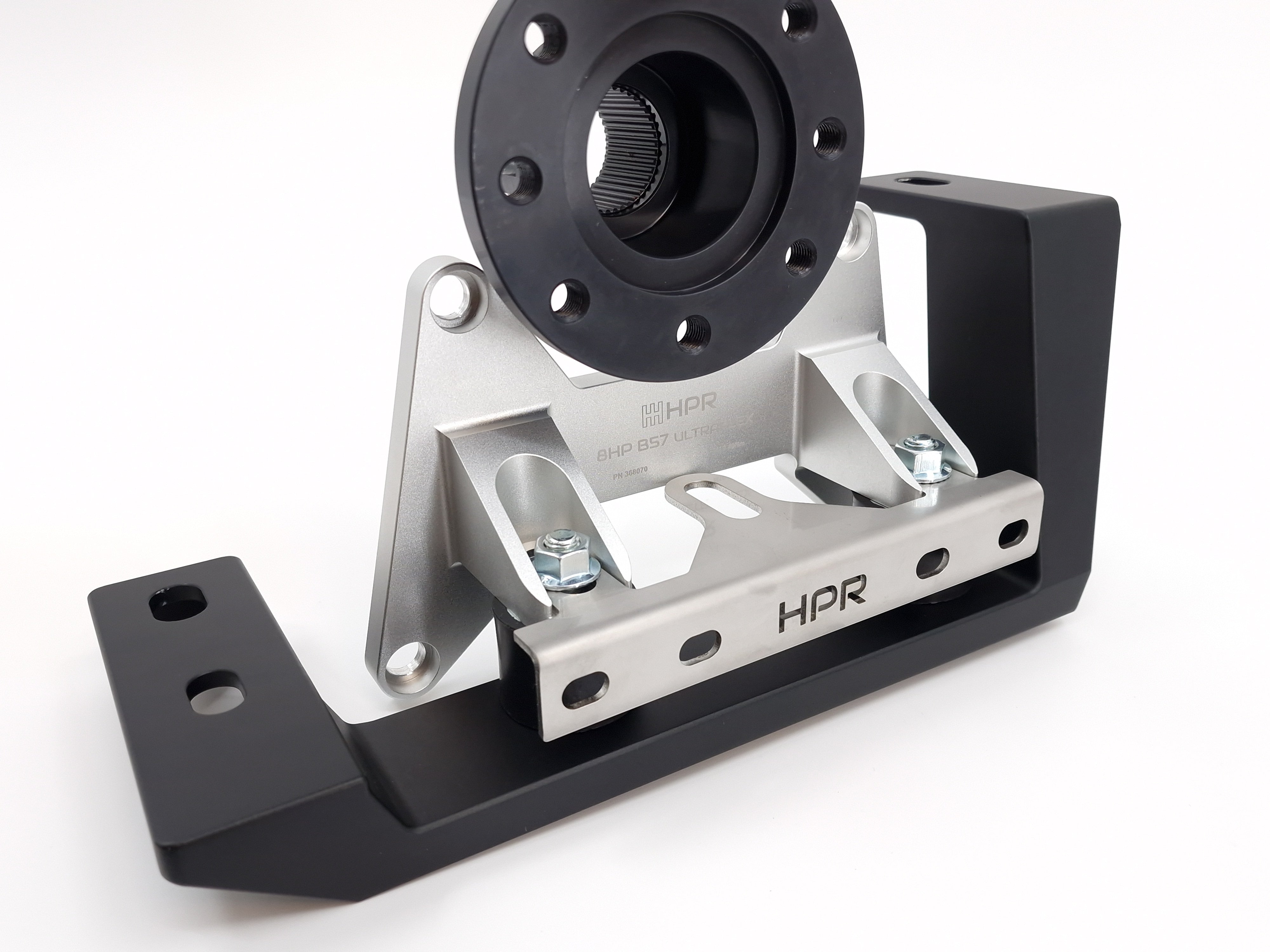 A black and silver Honda S2000 8HP kit transmission mount kit, featuring billet aluminium and various bolts and hardware.